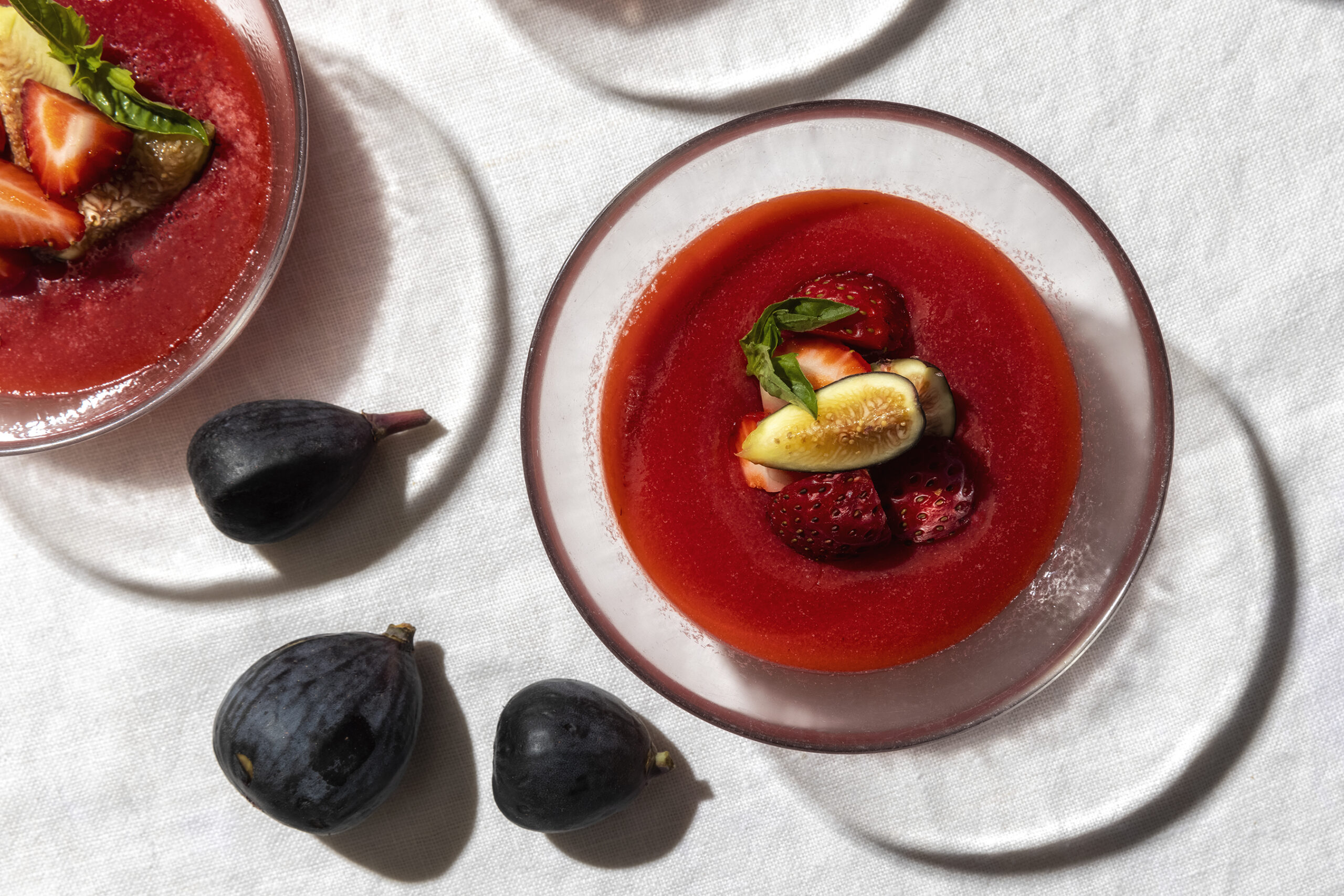 Fruit Soup with Figs and Strawberry Garnish